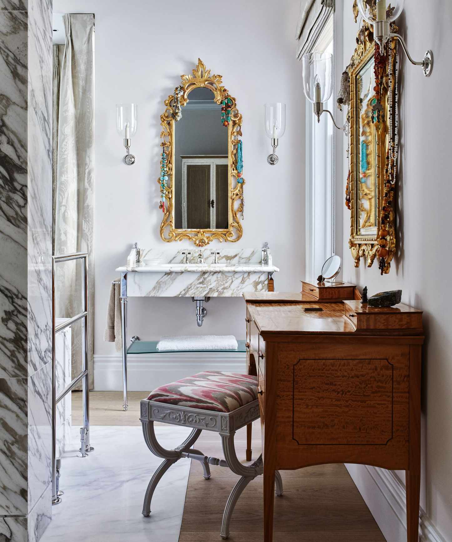 Gold framed mirror, sink, wooden table