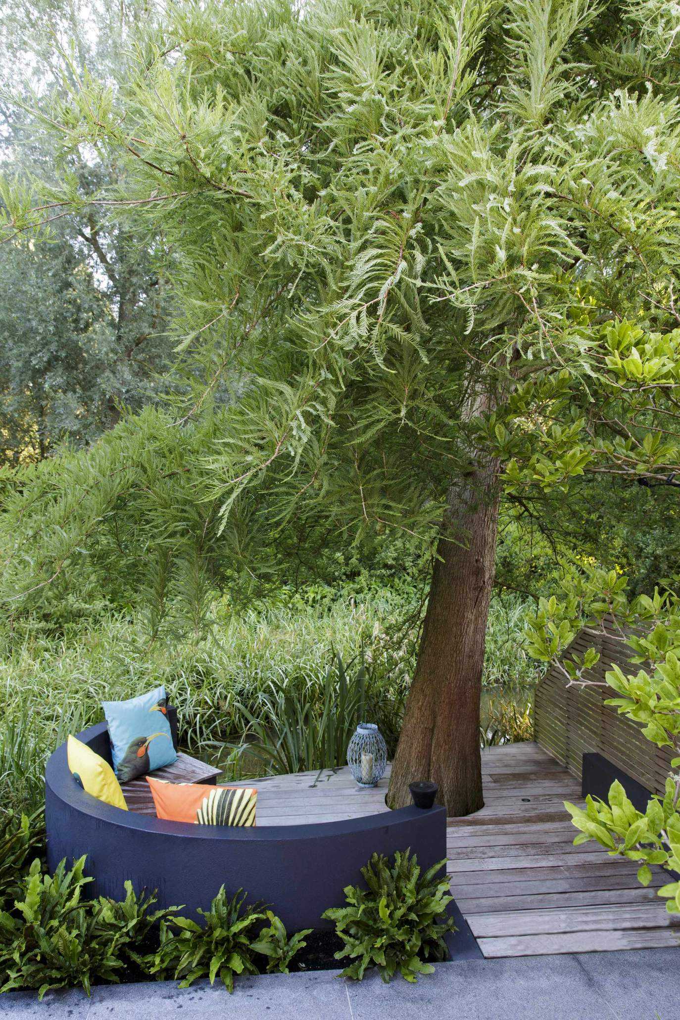 patio built around a tree with seating area