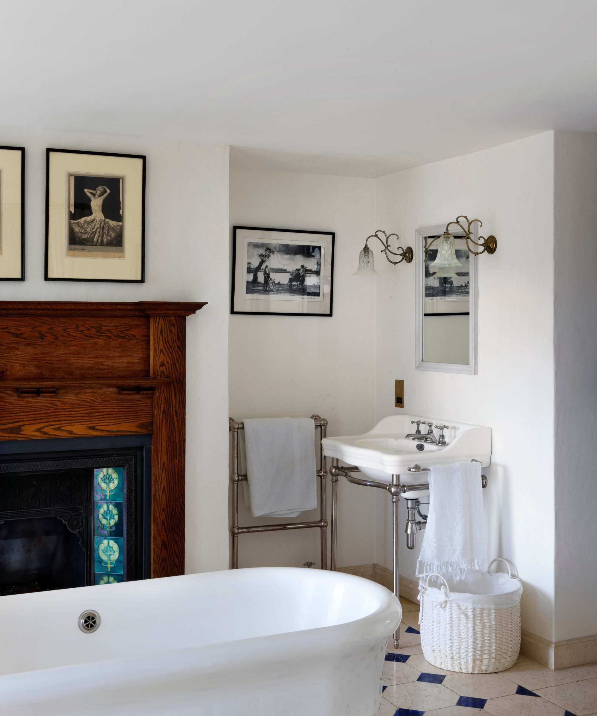 modern bathroom with old wood antique fireplace