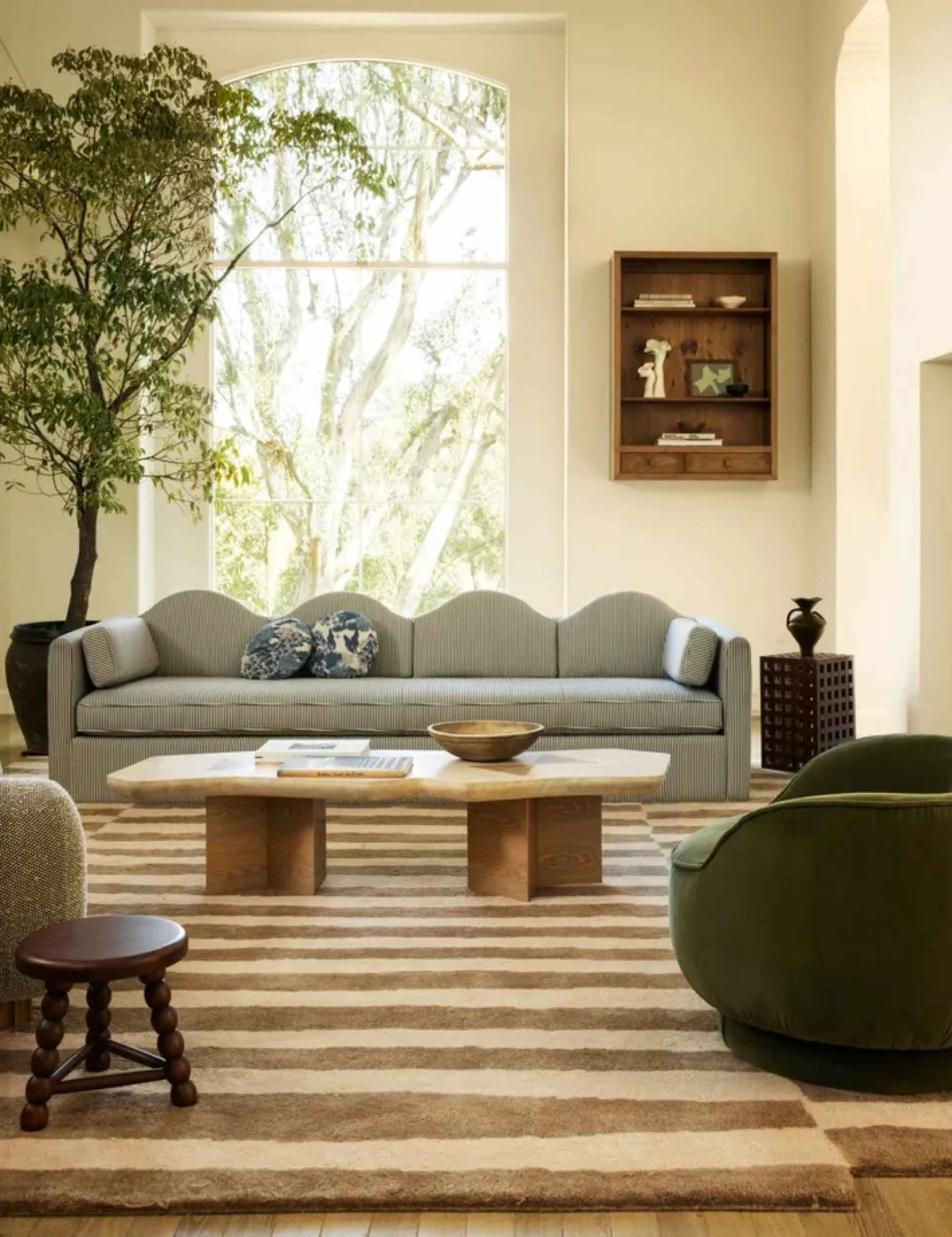 modern living room designed by sarah sherman samuel for lulu and georgia with a striped curvy couch
