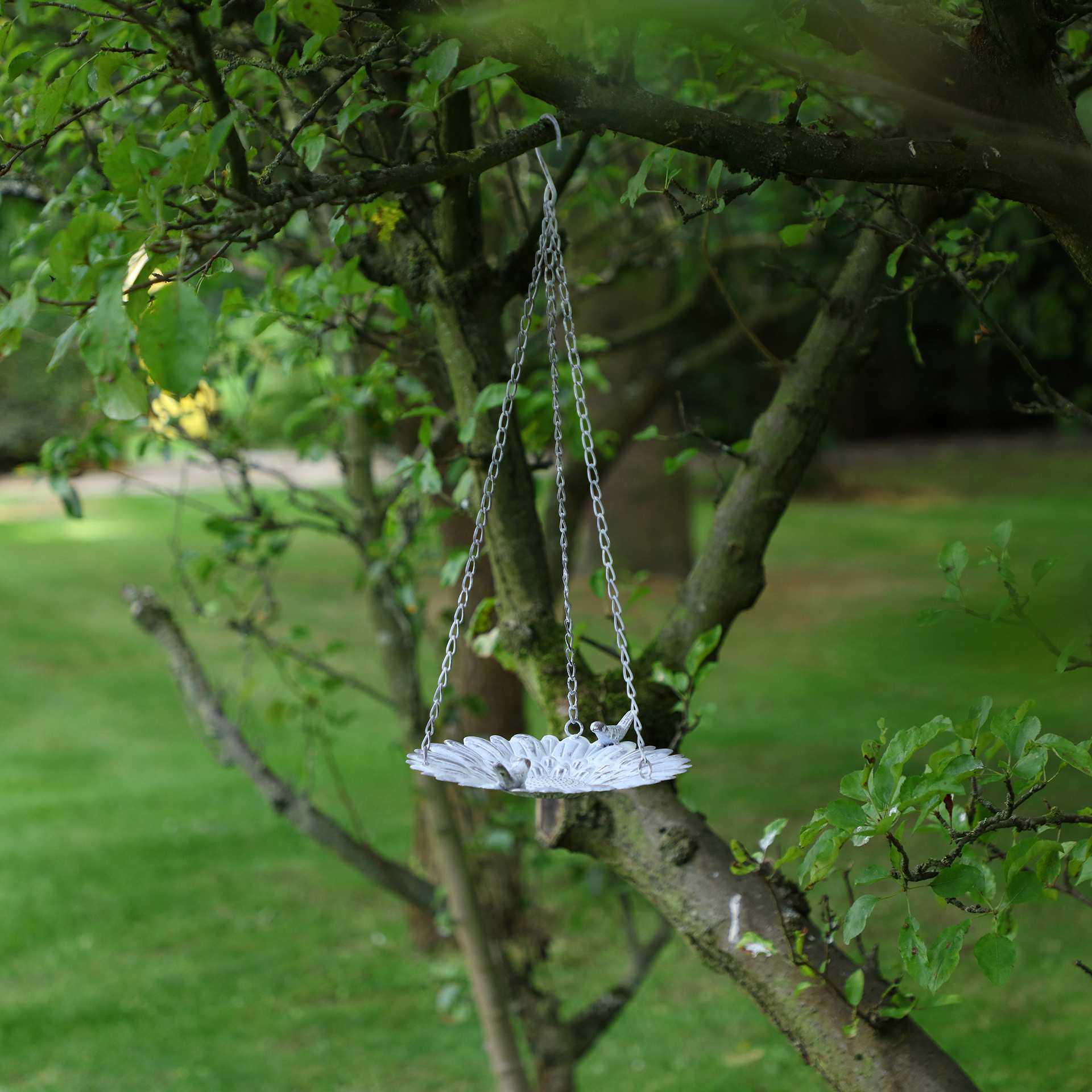 hanging sunflower bird bath in tree