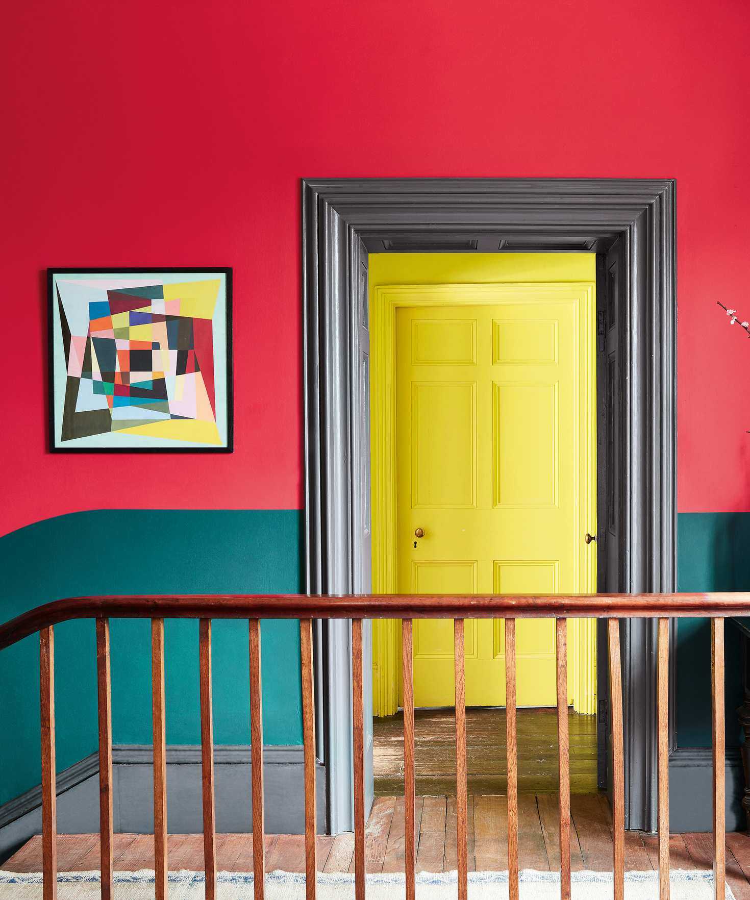 Red painted wall with yellow door