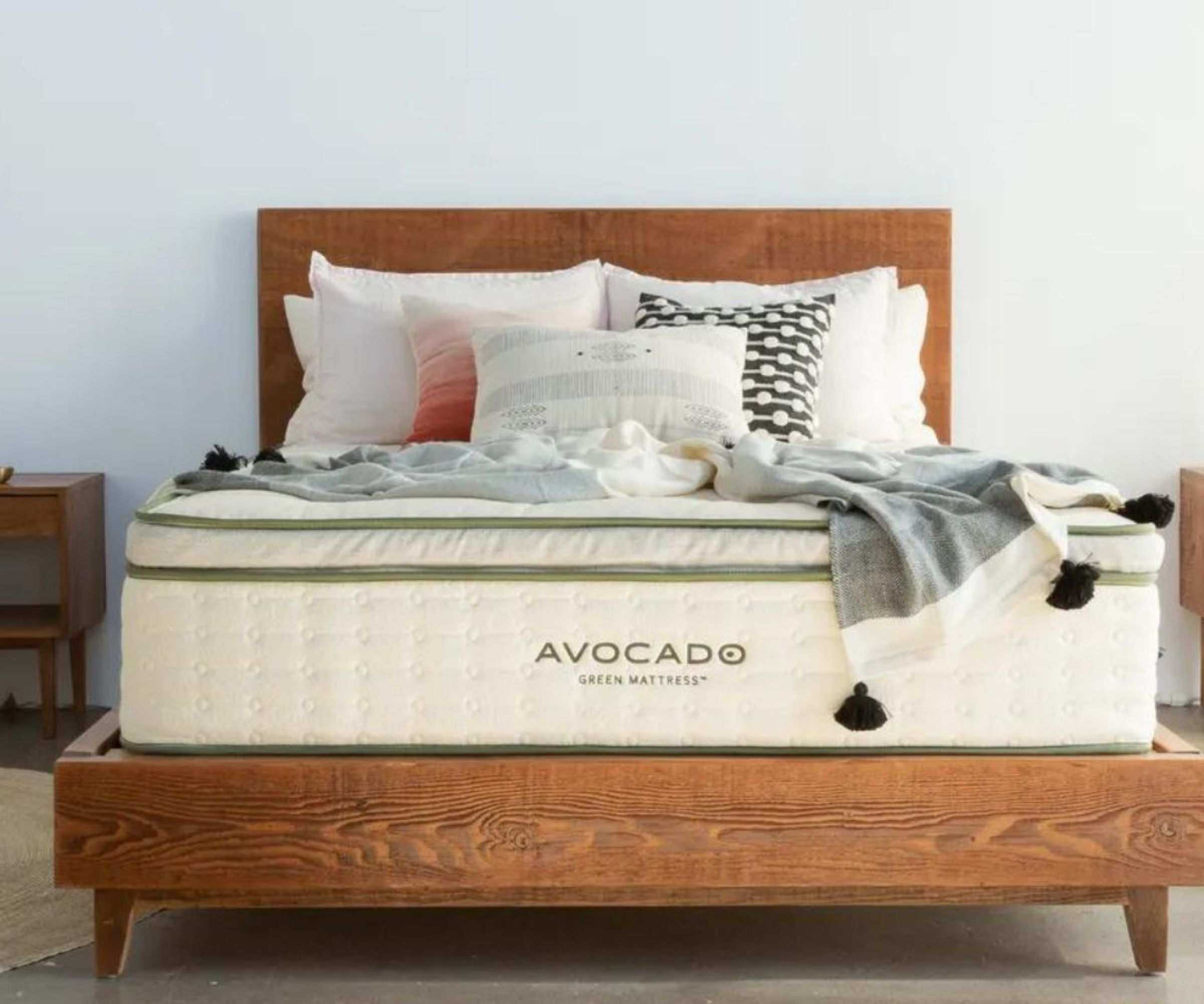 Cushions and blankets on the Avocado Green Mattress.