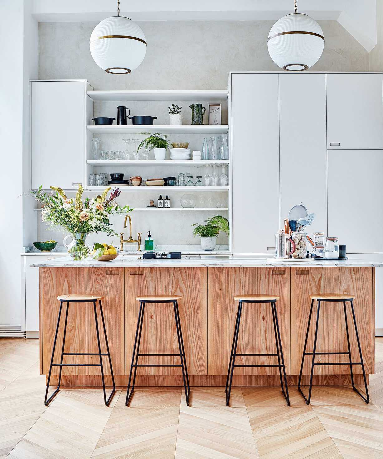 Neutral kitchen with white cabinets and wood accents