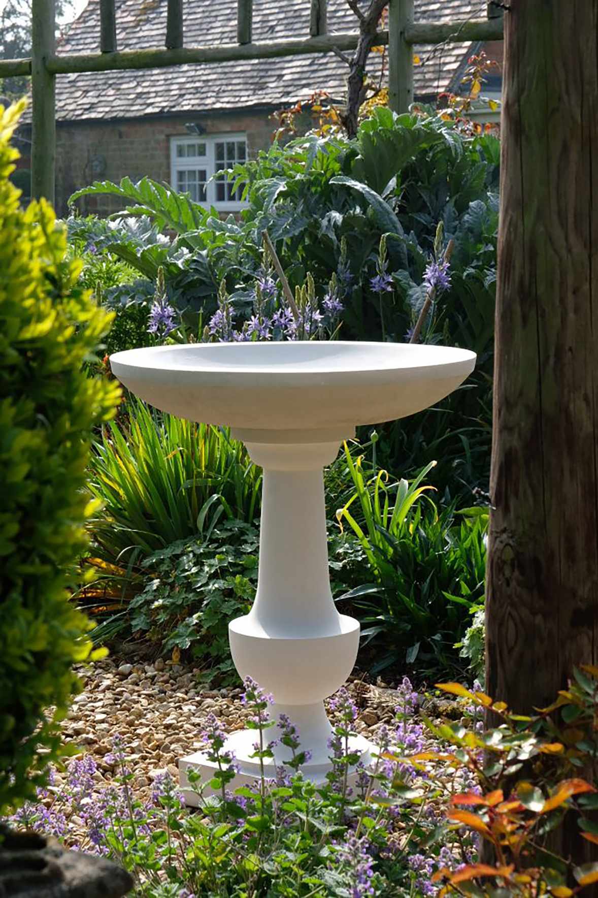 white stone bird bath
