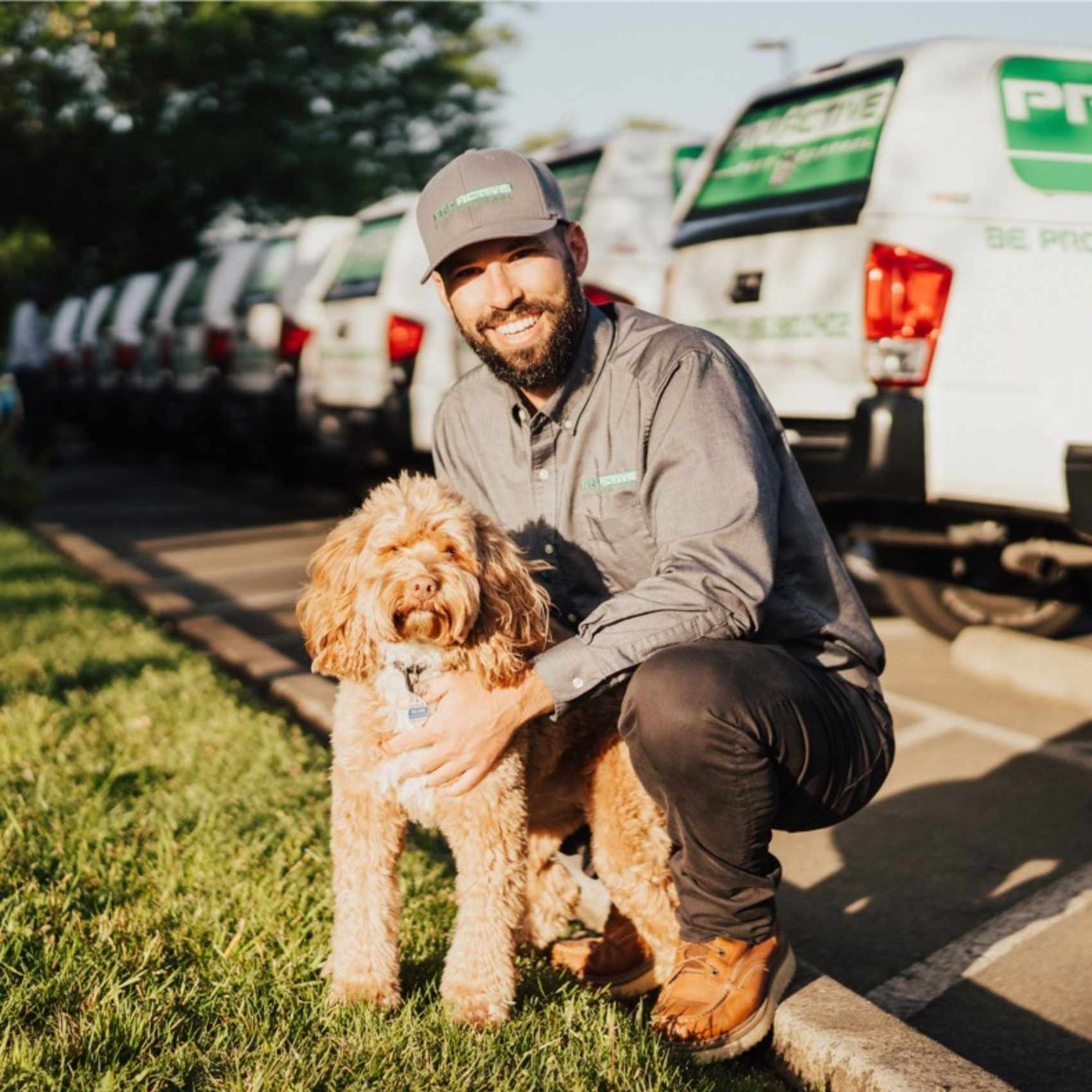 Pest control specialist with a cockapoo dog