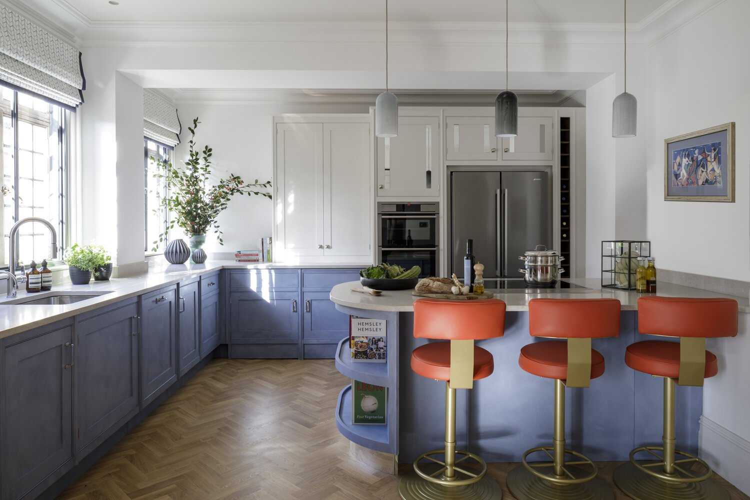 Kitchen with red bar stools
