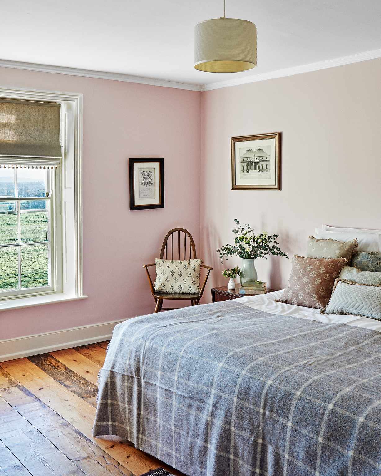 Pink bedroom with a view of the countryside