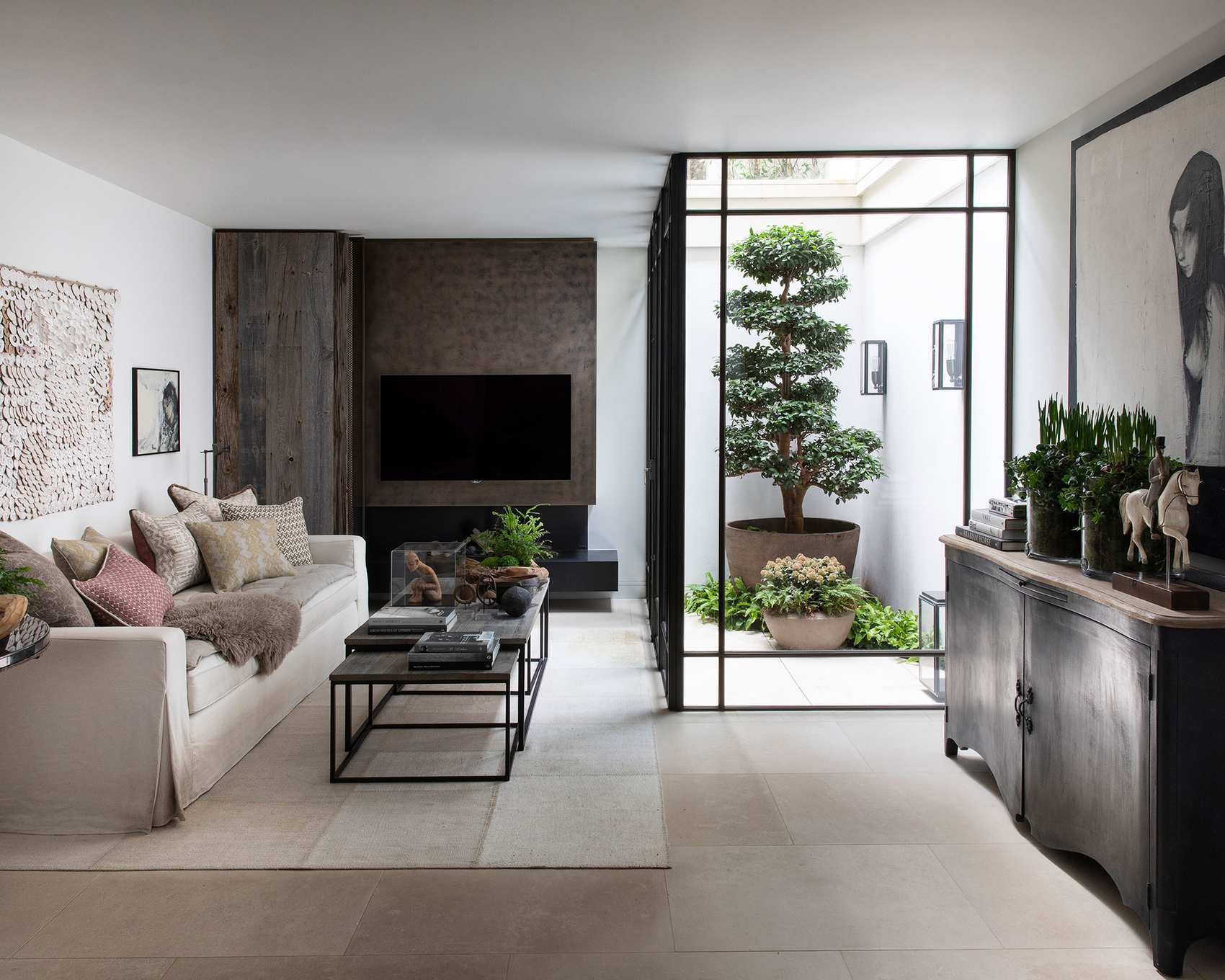 Modern living room with wood wall paneling and TV