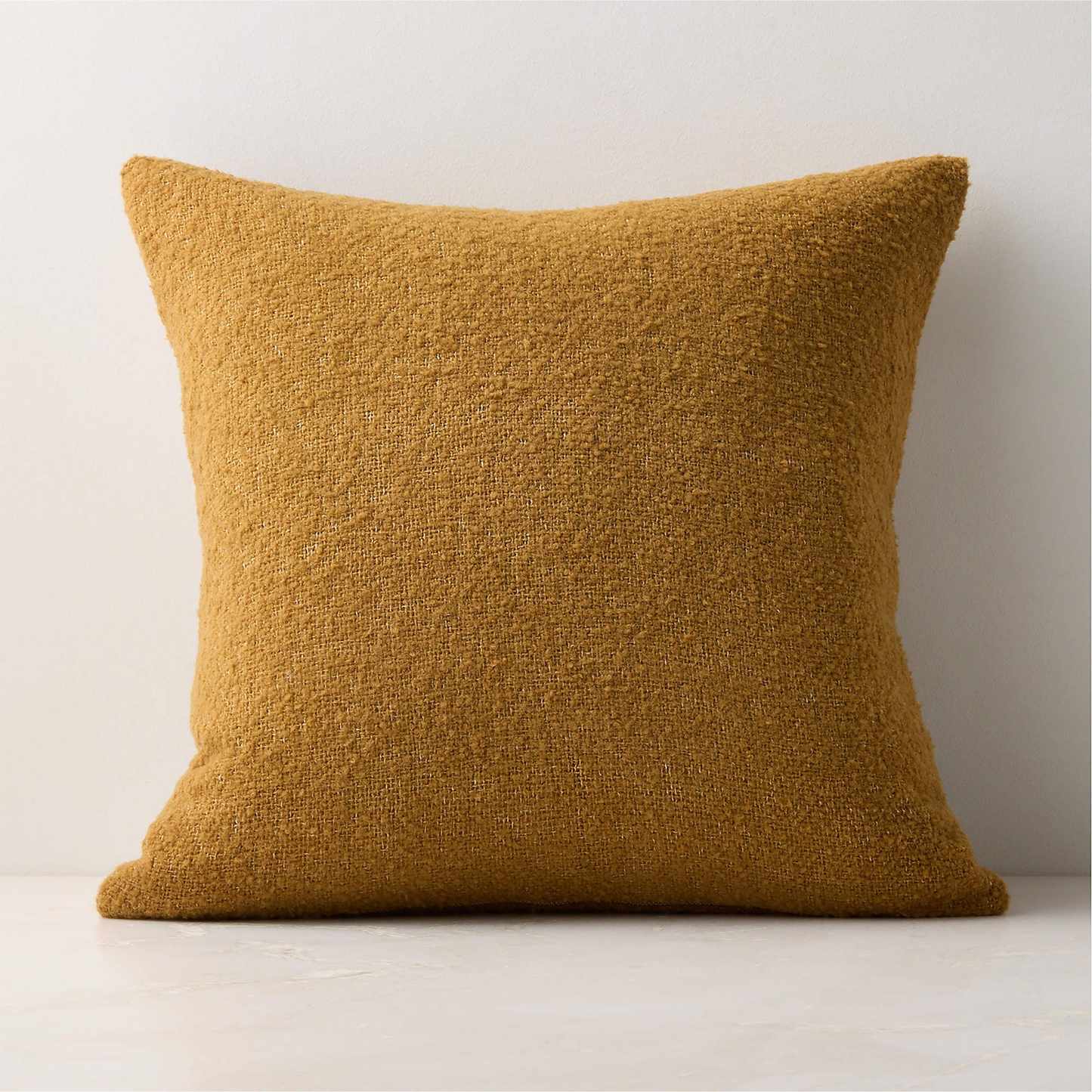 Pale orange boucle cushion