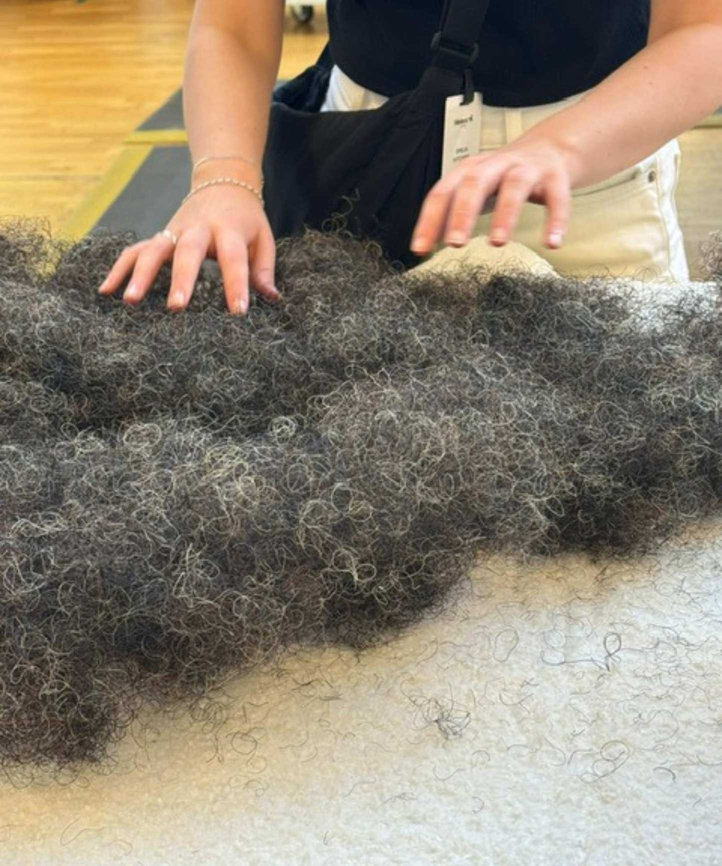 Emilia teasing the horsehair for a H&auml;stens mattress.