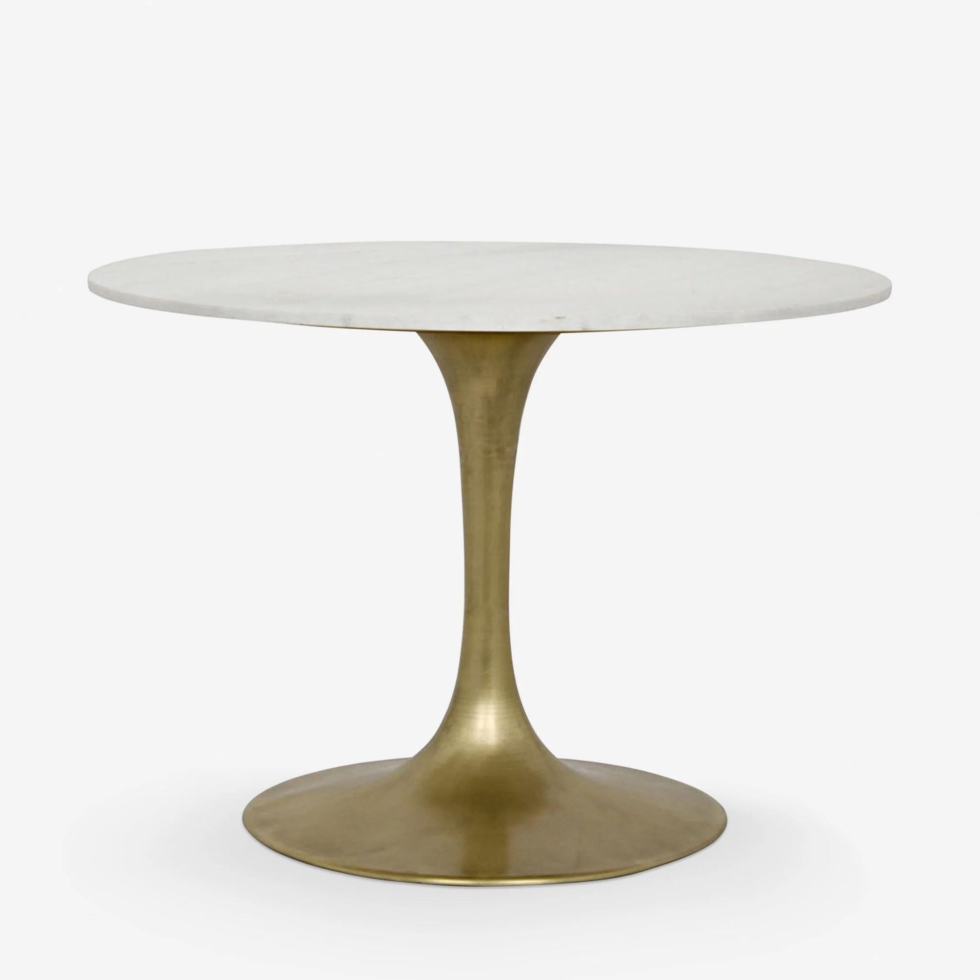 Lulu and Georgia Lillia Round Dining Table against a white background.