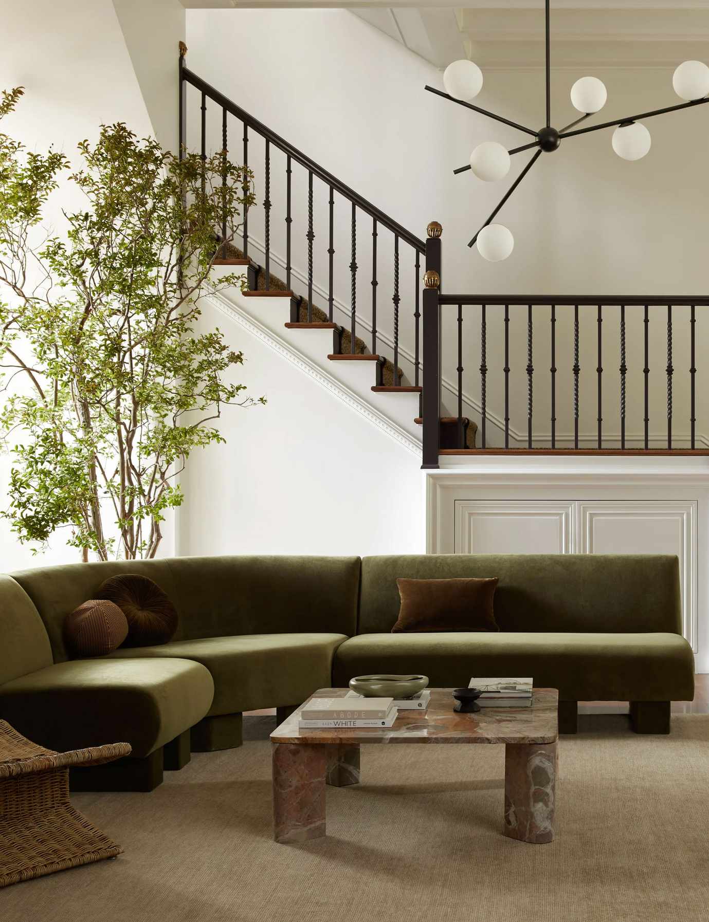 Lulu and Georgia living rom with green sofa, marble coffee table