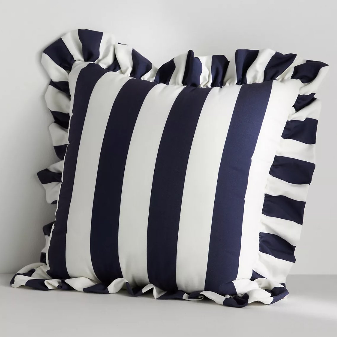 blue and white stripe pillow with ruffle edge