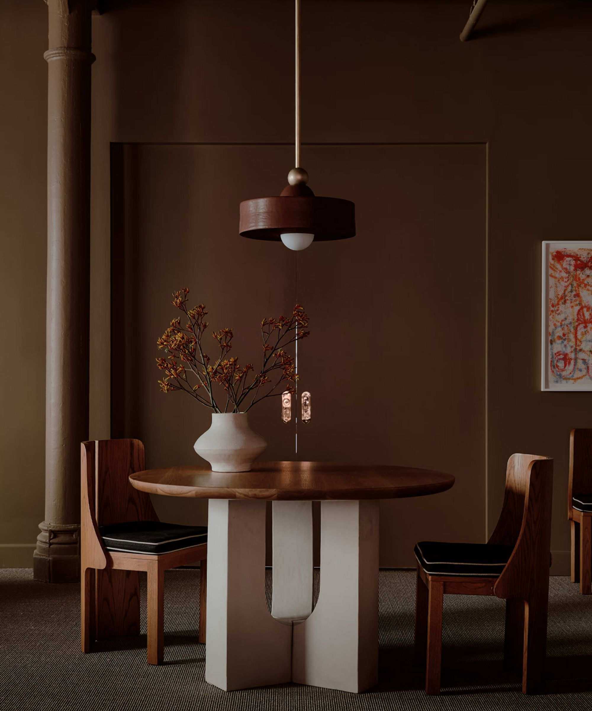 Brown dining room with wooden table and chairs