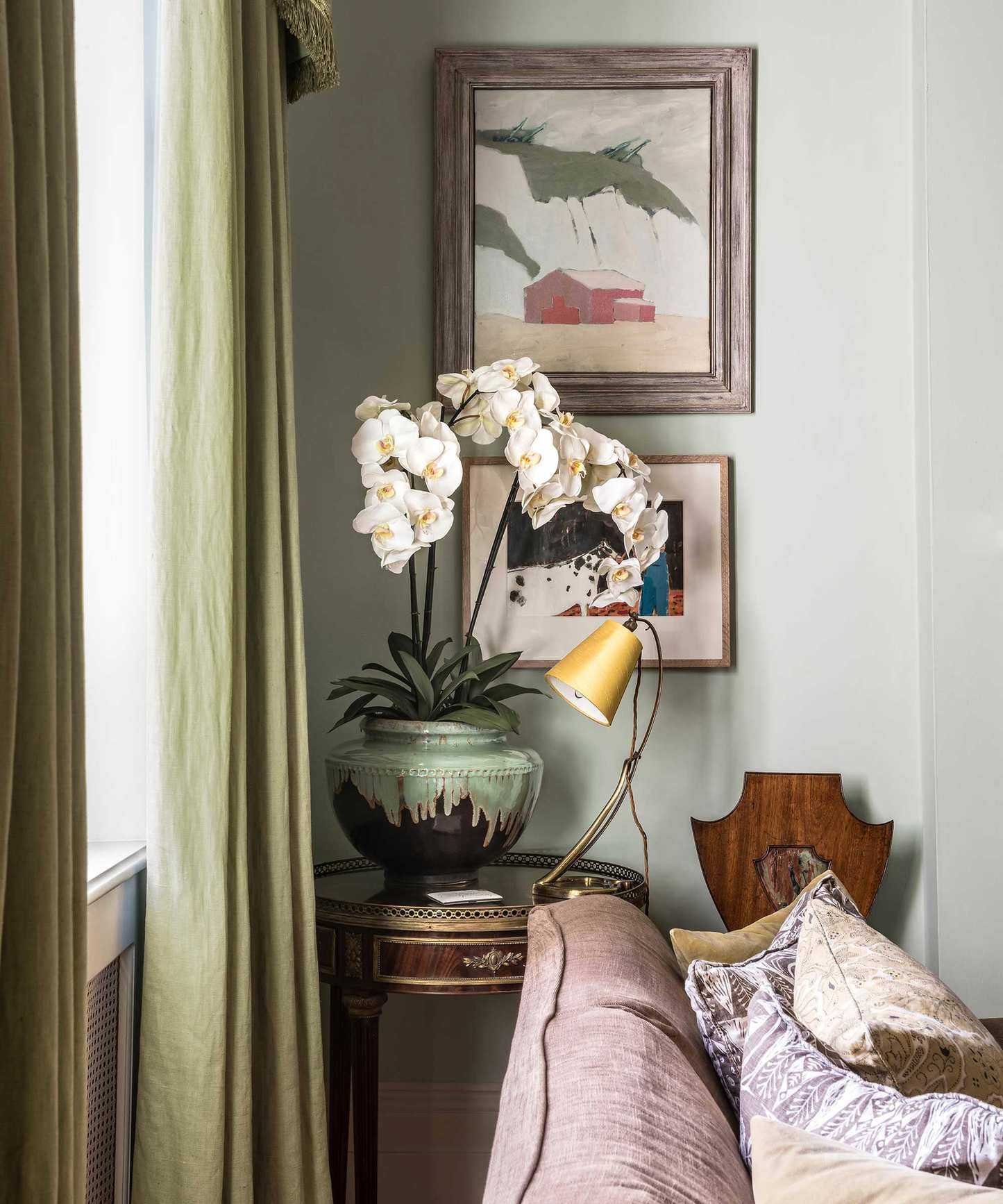 potted white orchid on side table in living room