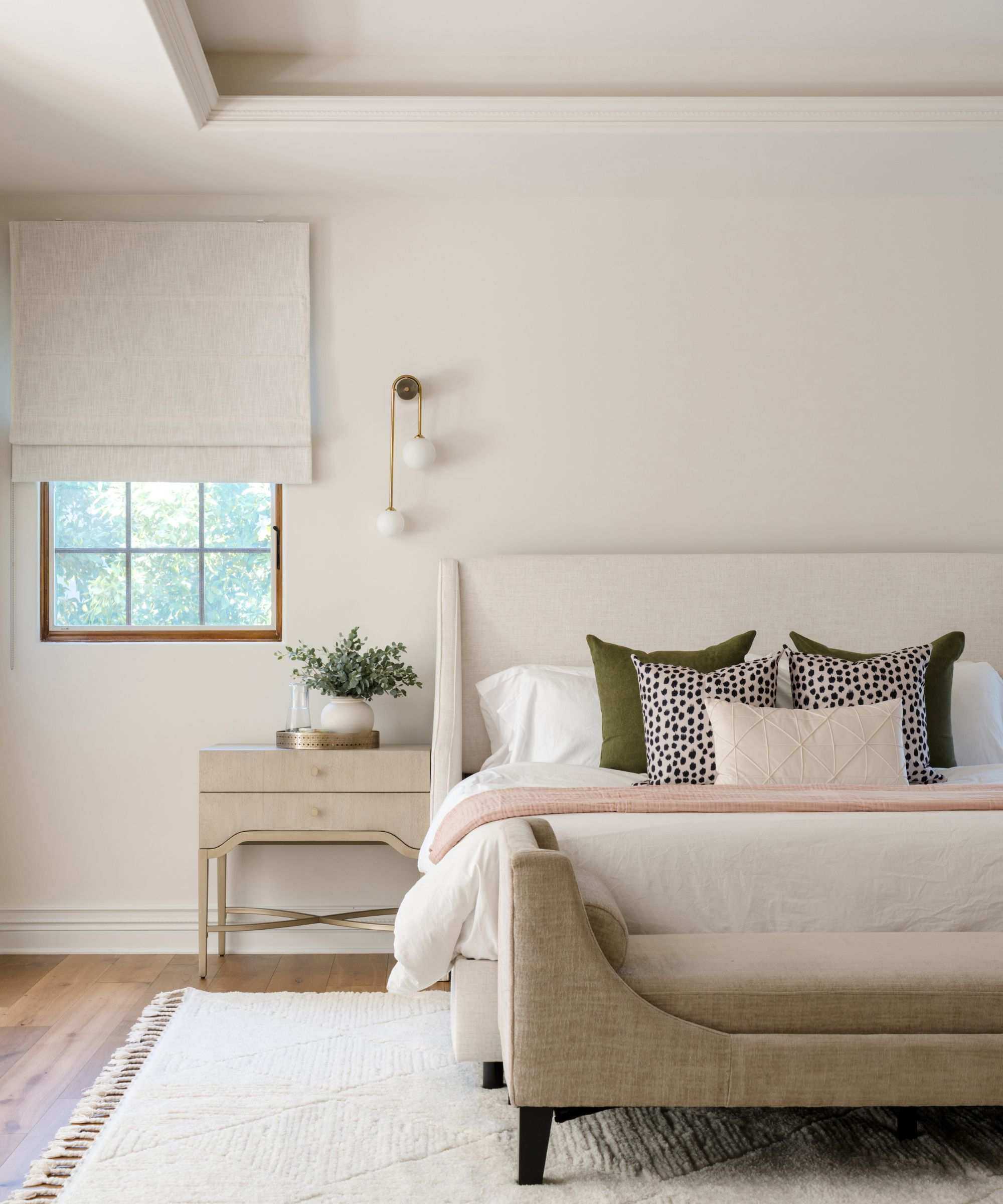 bedroom with cream walls and furnishings