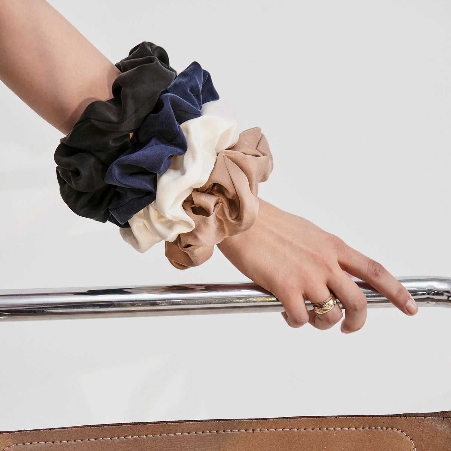 Colorful scrunchies and hair ties on an arm