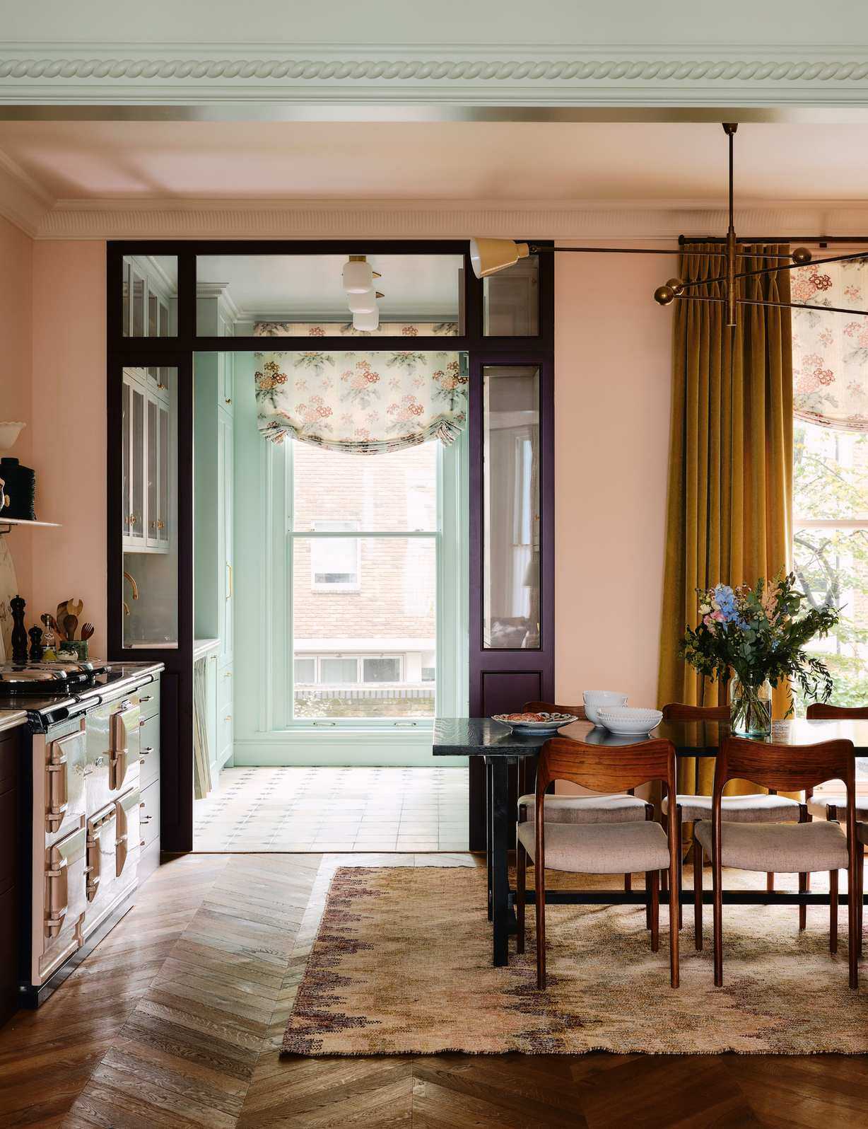 Open concept kitchen area featuring mid-century dining furniture