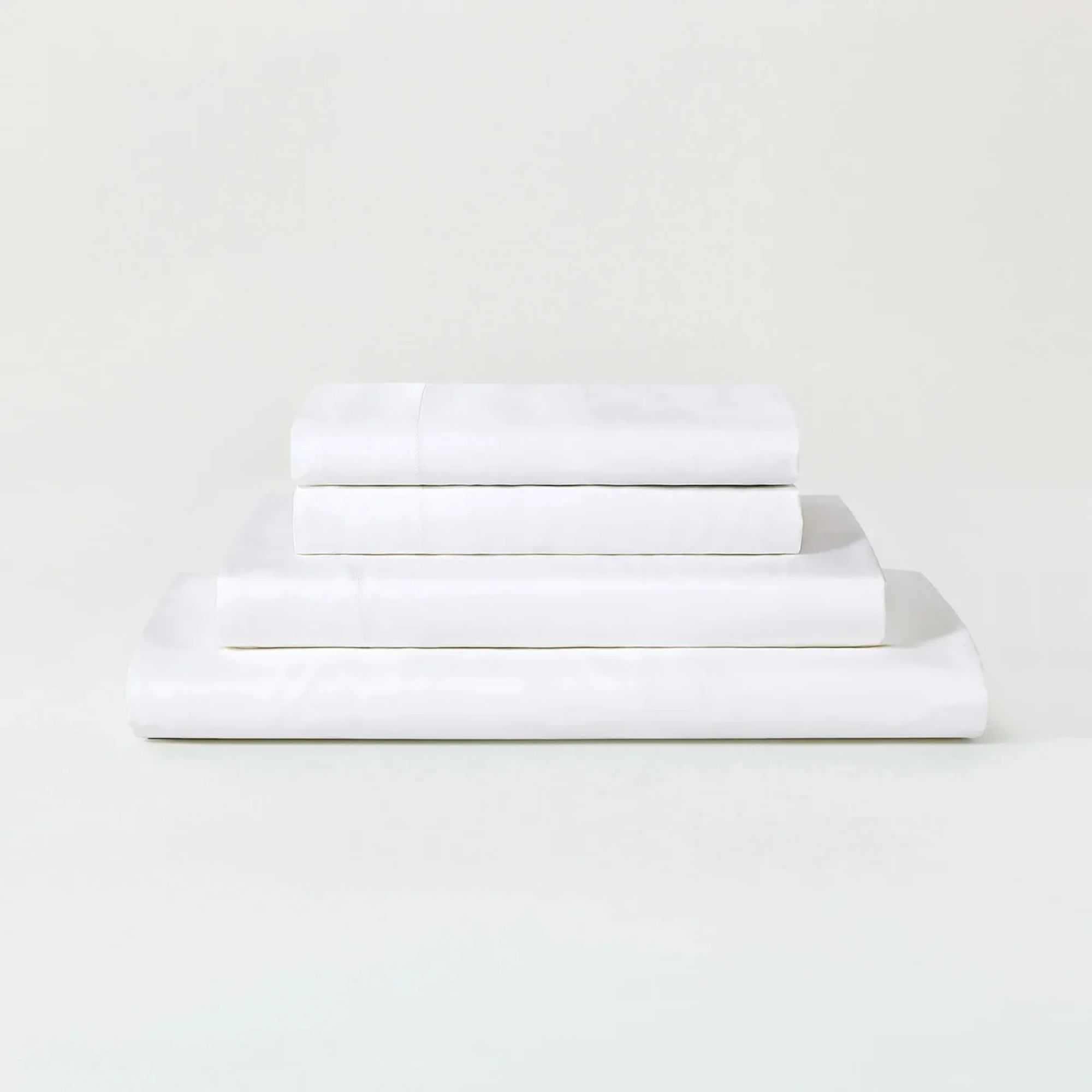 A white Sijo AiryWeight Eucalyptus Sheet Set folded and stacked