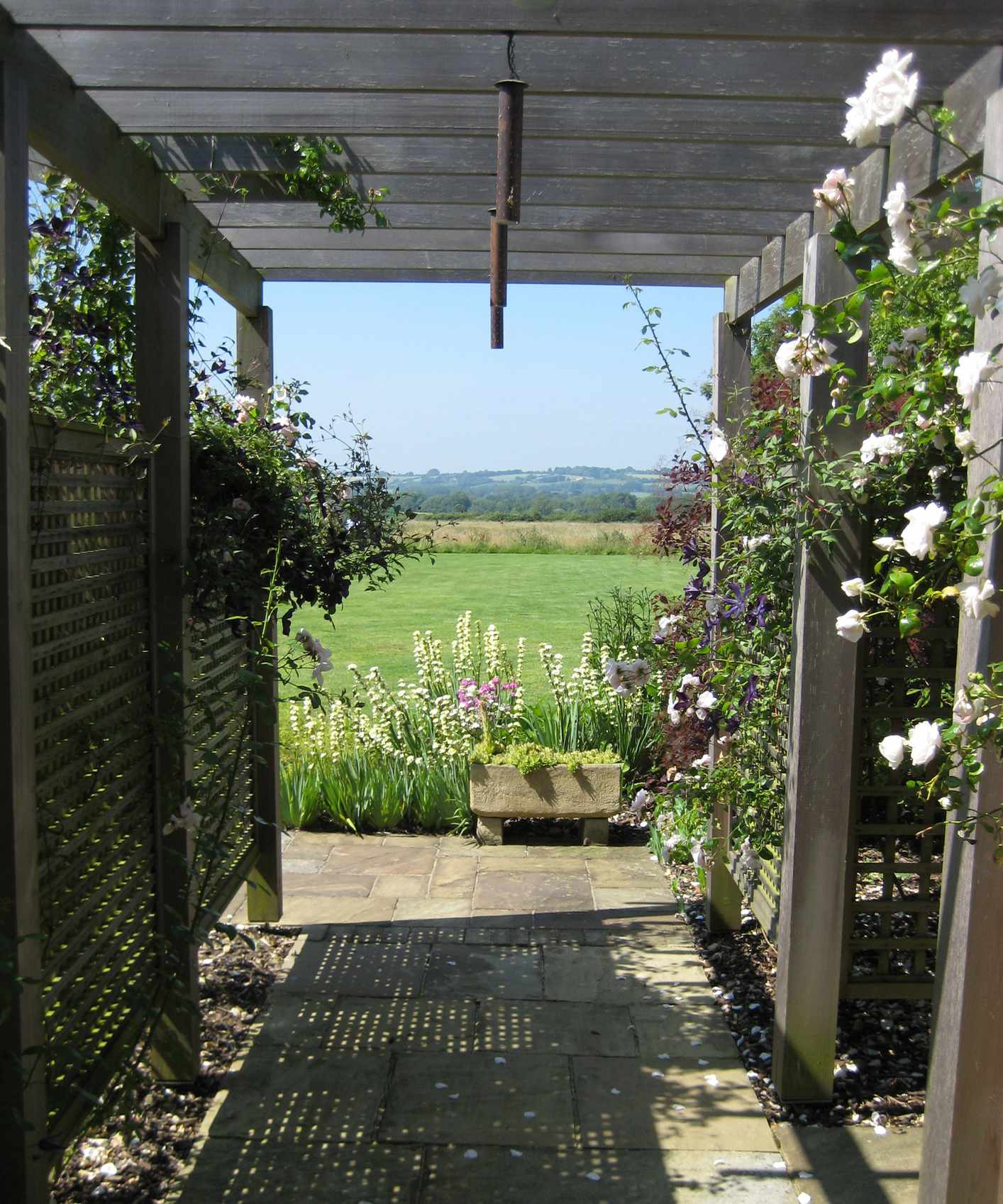 wooden pergola framing the view of surrounding countryside