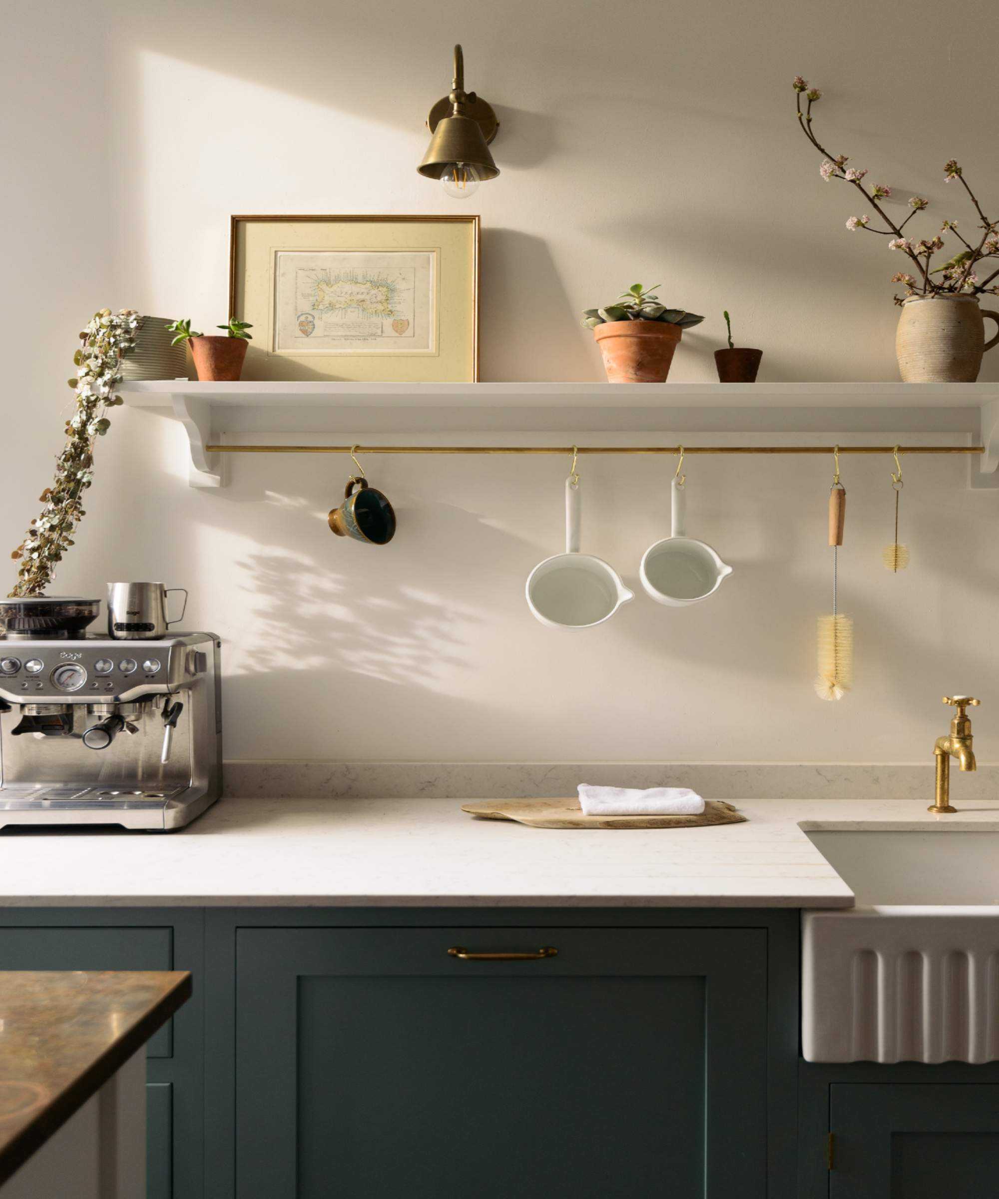 Dark green base cabinets, white marble counter top