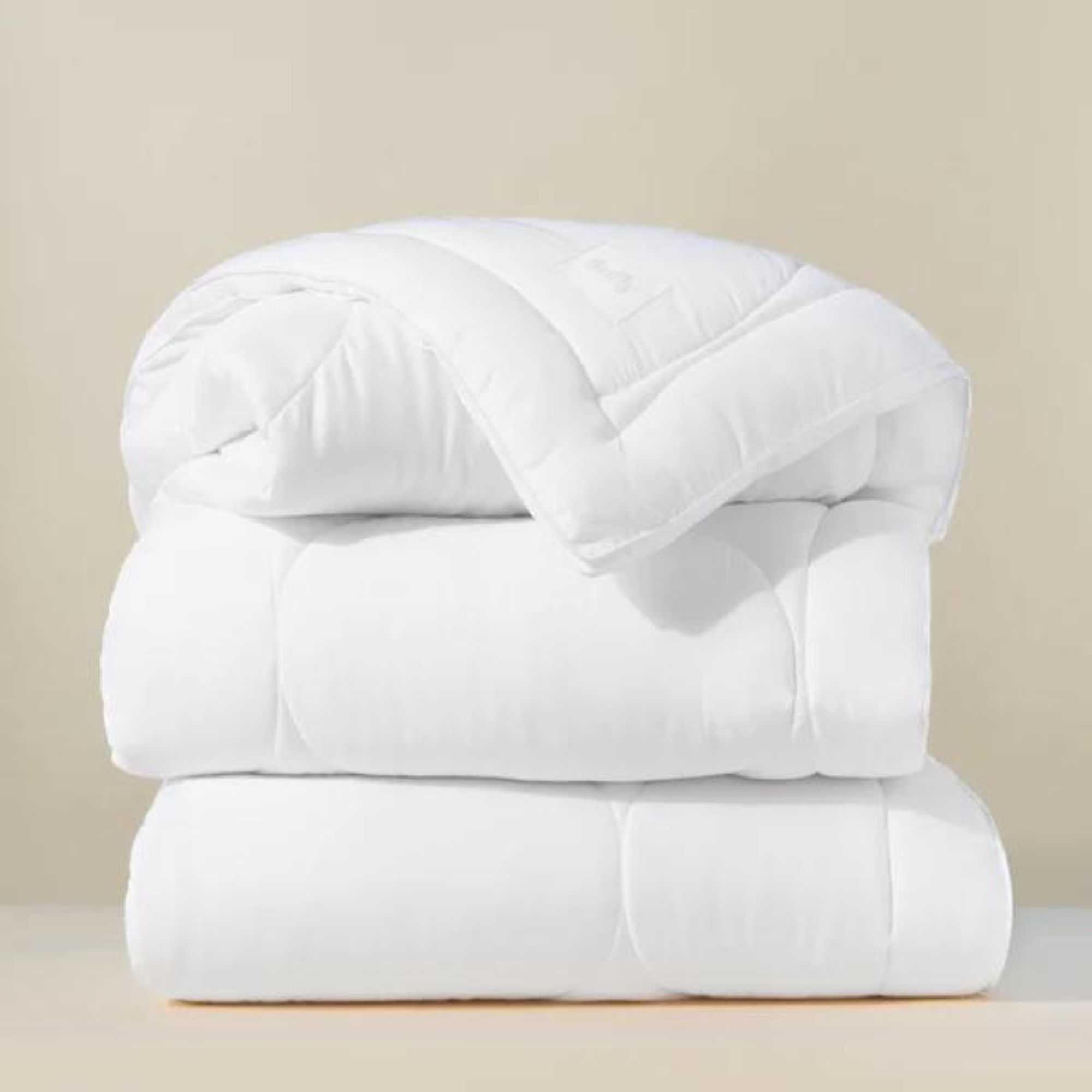 Cloud Comforter against a beige background.