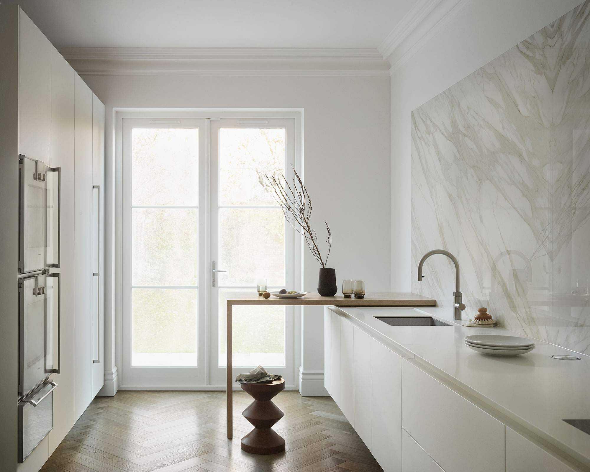 Modern kitchen with white color scheme and galley layout