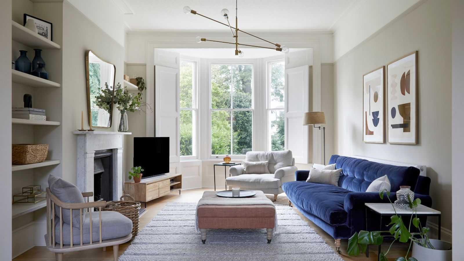 The 4 Clever Layout Tricks Designers Use to Make a TV Less Dominant in Your Living Room