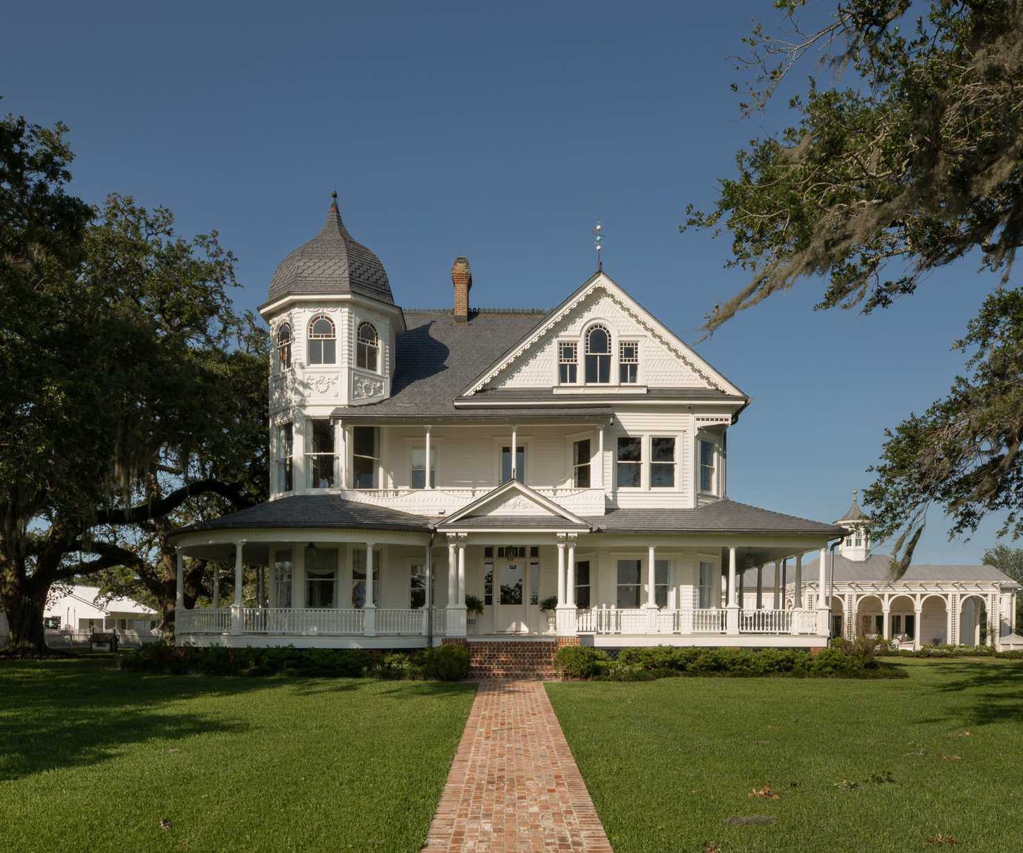 exterior of white clapboard Victorian home