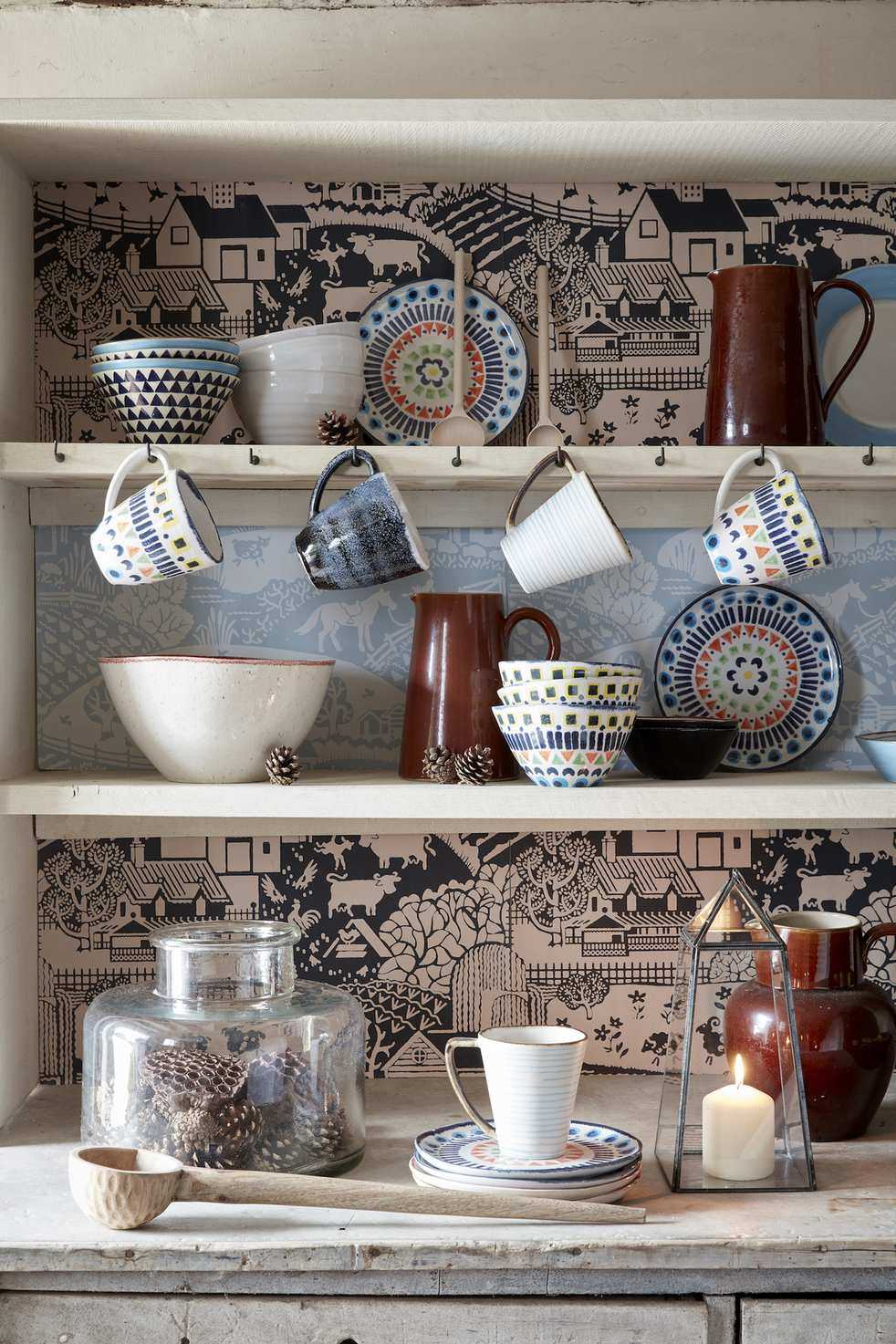 farmhouse style dresser with decorated shelves with colorful crockery