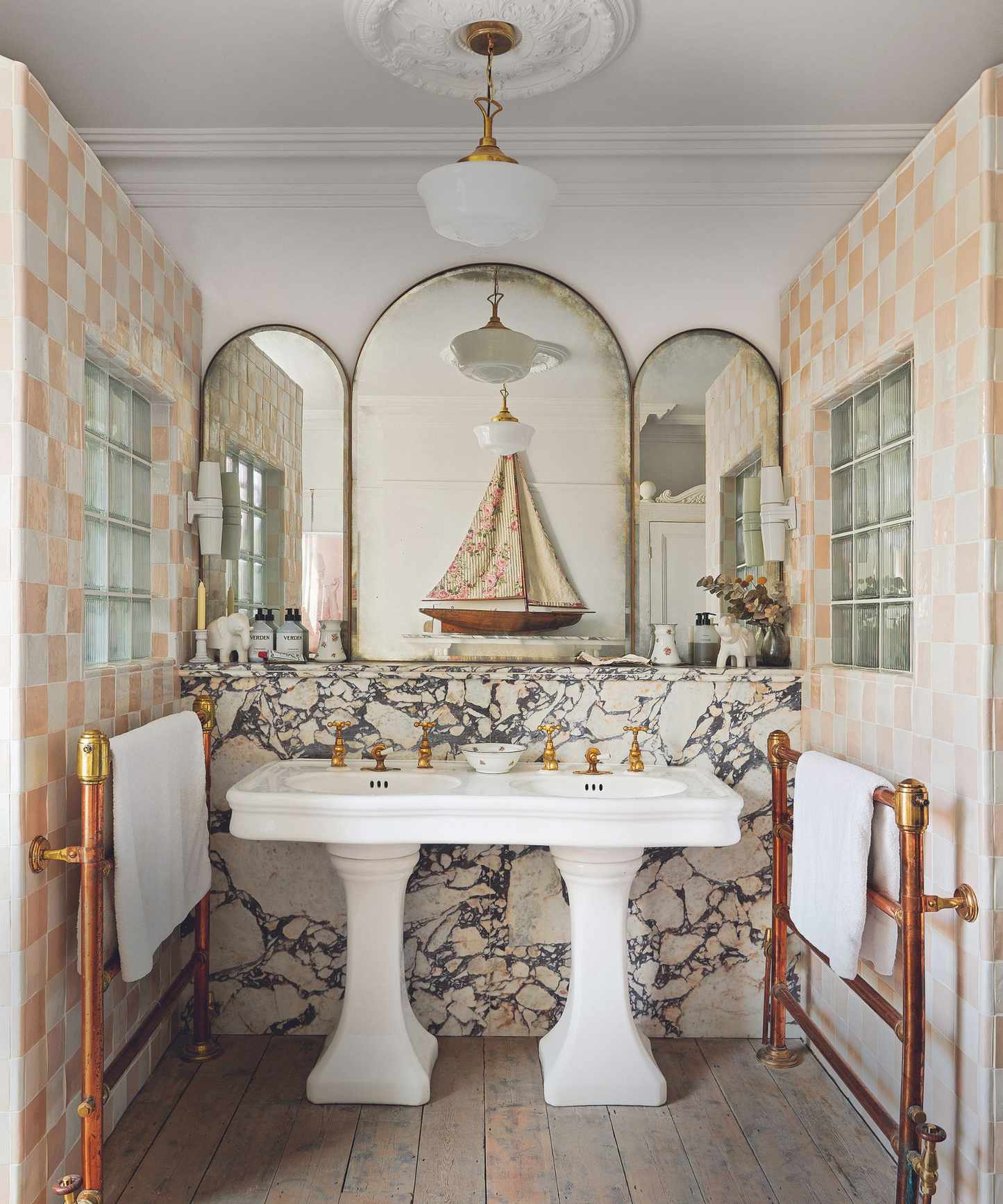 Double vanity bathroom idea with standing basins and marble behind