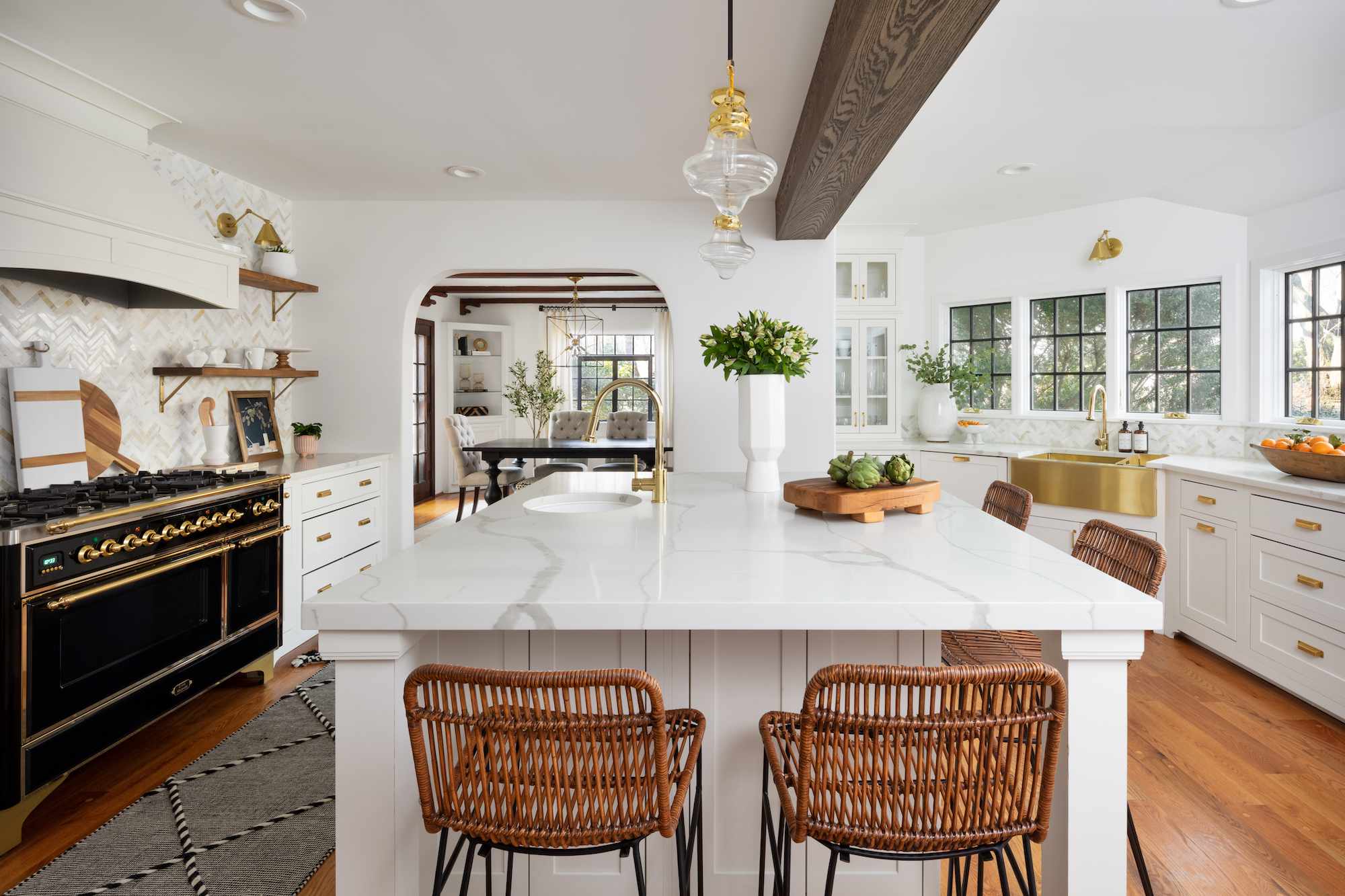 kitchen with white marble island top and black range cooker